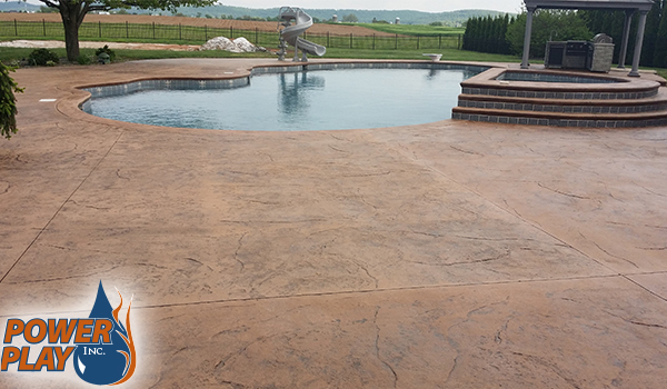 Stamped concrete patio with restored color after sealing