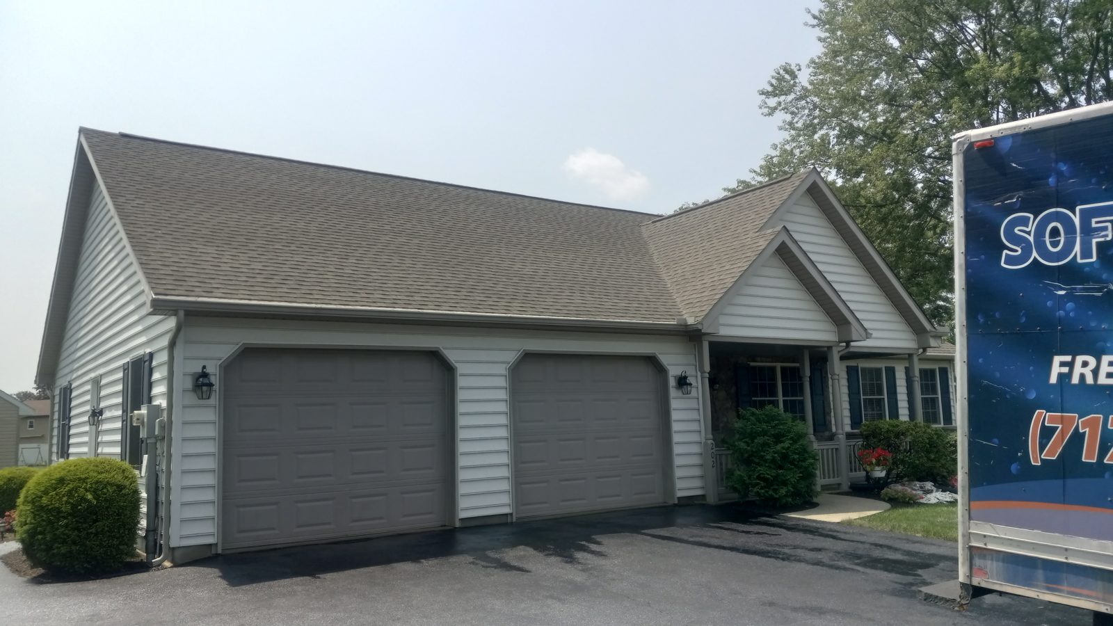 Same garage roof after a Power Play soft wash roof cleaning
